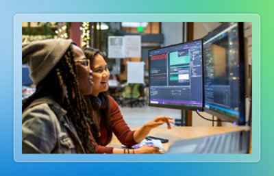 A group of people looking at a computer screen.
