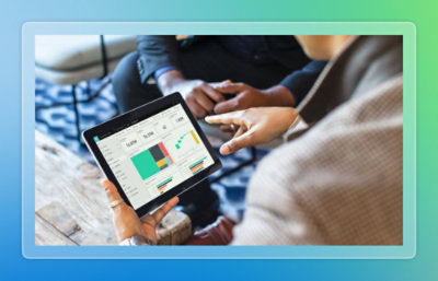 Reviewing analytics on a tablet during a discussion.