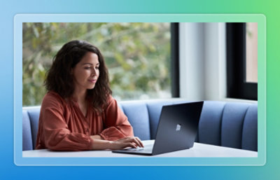 A woman is working on a laptop.