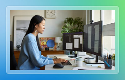 A woman is working on a computer.