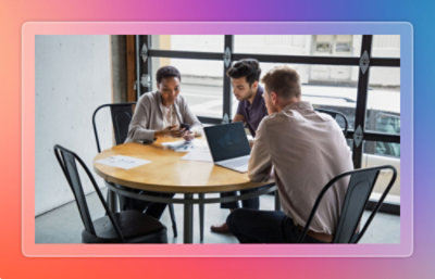 A group of people sitting around a table.