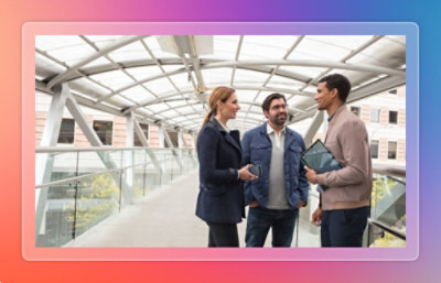 Three employees discussing.