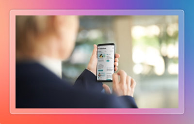 A hand holding a cell phone.