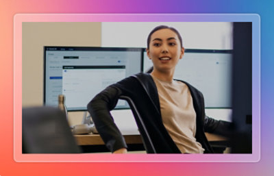 Two employees discussing while being quite happy.