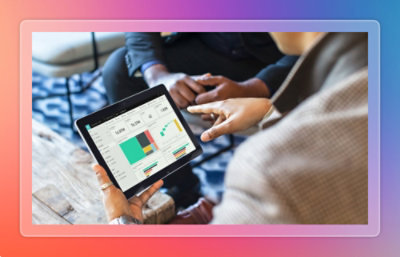 A close-up of hands holding a tablet.