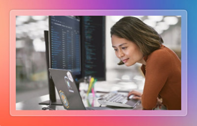 A woman looking on multiple device screens