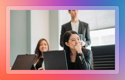 People working together with laptops in a conference room
