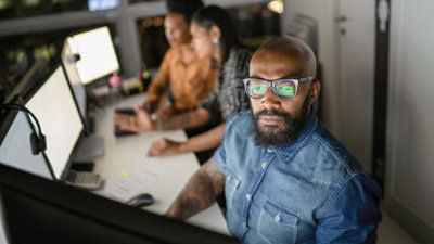 People working at a recording workstation.