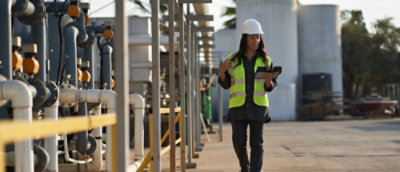 A person wearing a yellow safety vest and a hard hat.