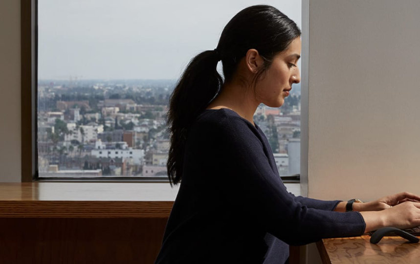 A person types on a Surface Laptop 3.