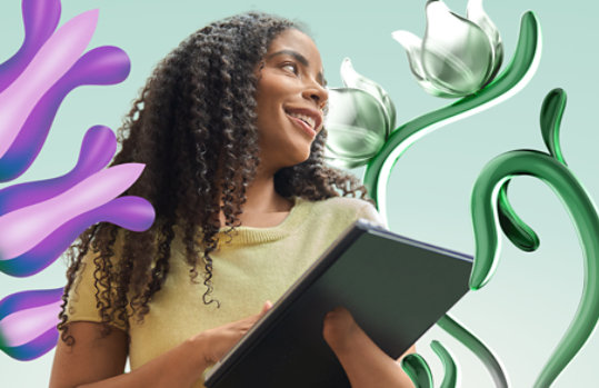 Woman smiling and holding Surface device, surrounded by computer generated flowers