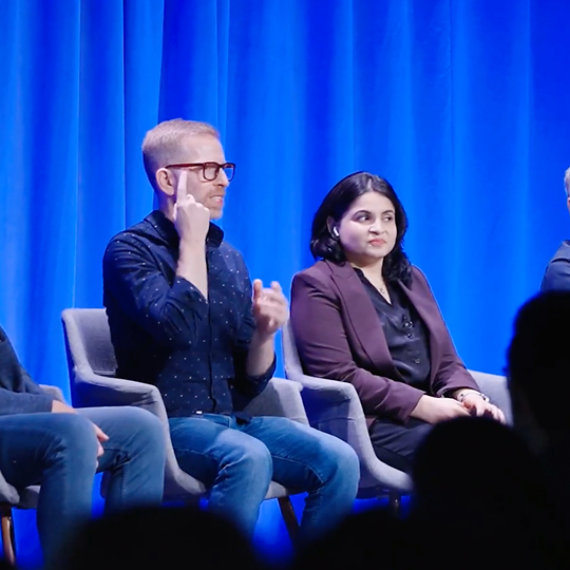 Accessibility Architect for Microsoft Teams, Chris Sano uses American Sign Language as he presents beside Principal Program Manager for Narrator, Nidhi Jain, during a panel discussion during the 2026 Ability Summit Keynote.