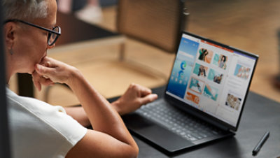 A user examines the Windows Insider program on the laptop's screen.