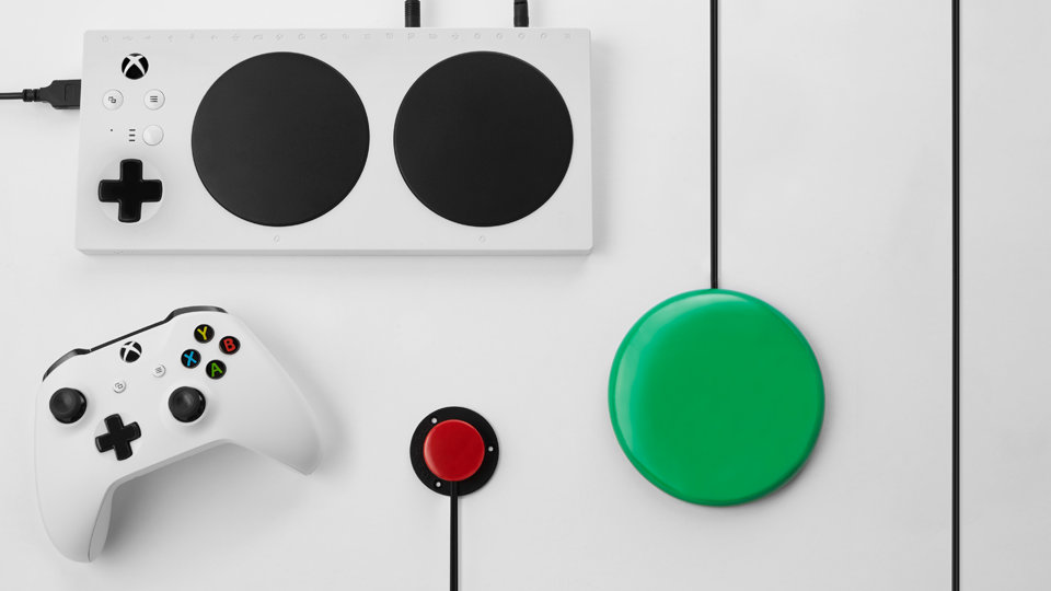 Xbox Adaptive Controller with external button, switch, and Xbox Wireless Controller.