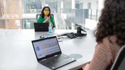 Two people having a meeting in a conference room.