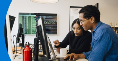 Two people working together in an office.
