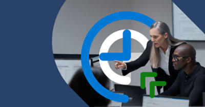 Two people working together at a desktop.