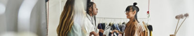Employees working in a small clothing store