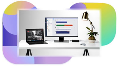 Un portátil en el que se muestra una presentación que se está realizando a través de una reunión de Teams y un monitor de escritorio que muestra un chat en Teams.
