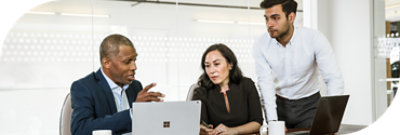 A group of people having a meeting in an office space.