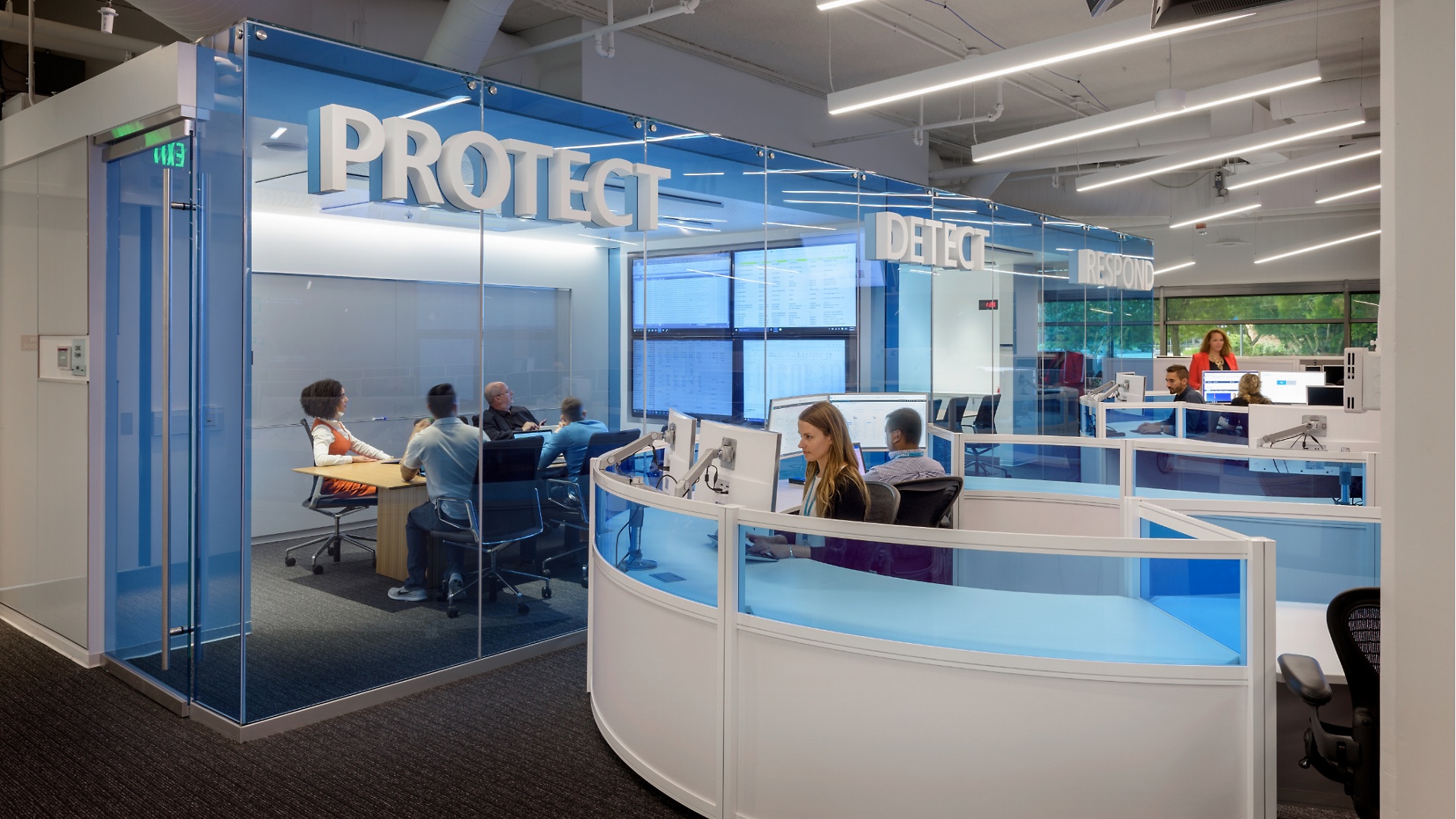 An office with the words Protect, Detect and Respond on the wall