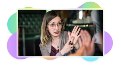 Two people having a conversation in sign language.