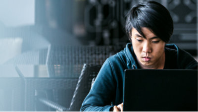 A man is working using his laptop.