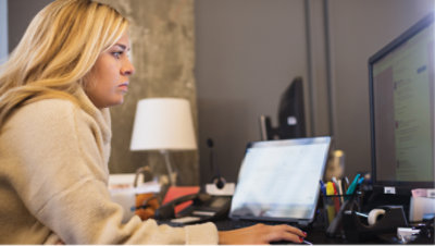 A woman working with a desktop