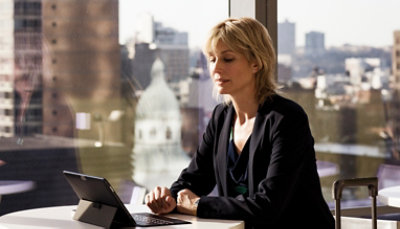 A person working on a laptop at a desk 