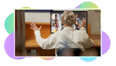 A person participating in a Teams video call at their desk.