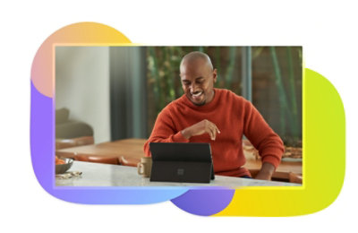 A person laughing while using a tablet