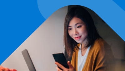 A person using their mobile phone to verify a new credential.