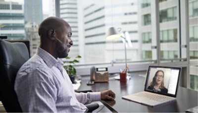 One person sitting and participating in a Teams video call with Women.