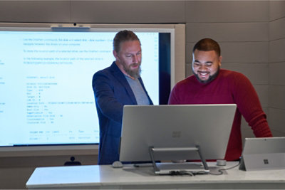 Woman thinking in a meeting.