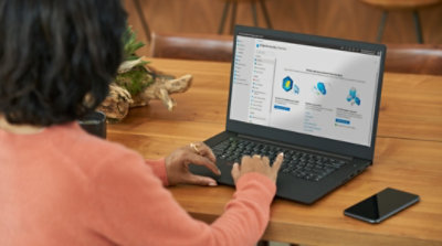 A person using Microsoft Defender for Business on their laptop