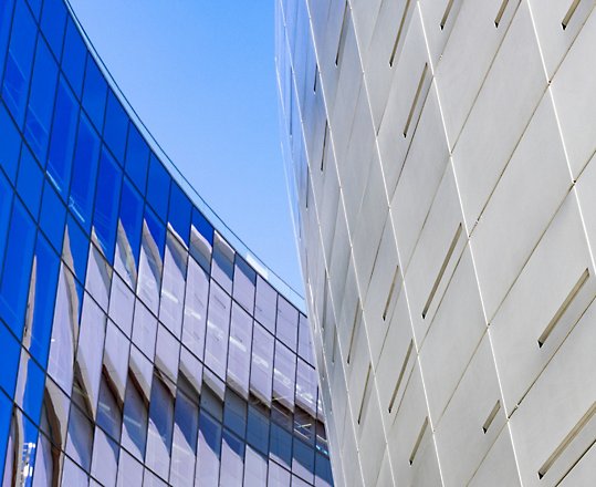 A close up of a building with a blue sky.