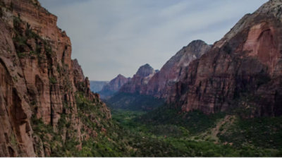 Two mountain ranges with a lush valley between them
