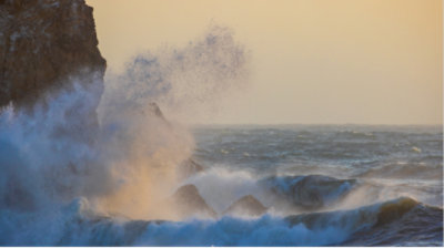 Waves crashing against a cliff