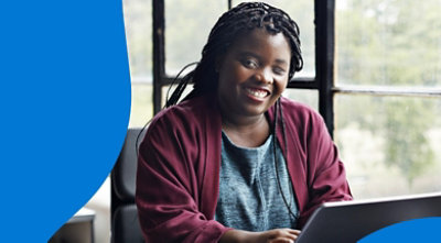 A person with one eye closed smiling.