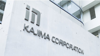 Exterior wall signage reads Kaijima Corporation on a modern office building.