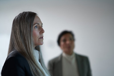 Two person looking aside.