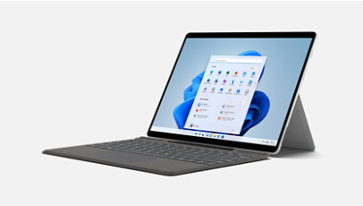 An open Surface Pro X with keyboard and Windows 11 on screen.