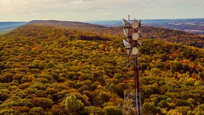 A telecommunication tower on a mountain ridge in the Appalachian Mountains in the fall.