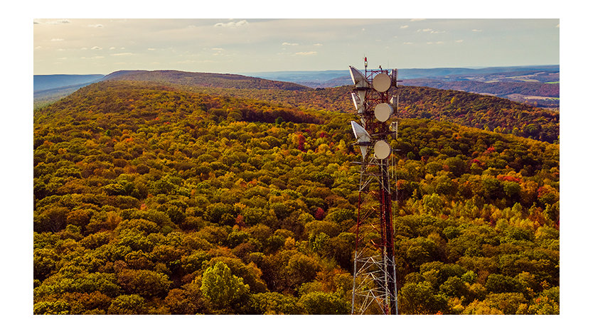 A telecommunication tower on a mountain ridge in the Appalachian Mountains in the fall.