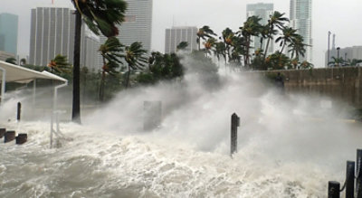 A hurricane striking the shore.