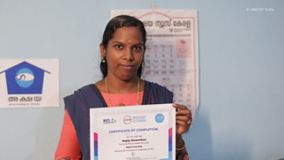 A person holding a certificate of completion for a digital productivity course.