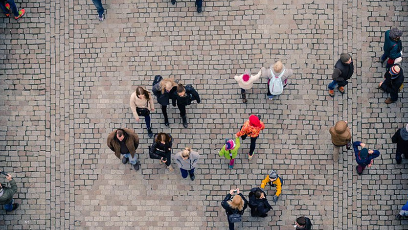 Aerial view of people walking on a street.