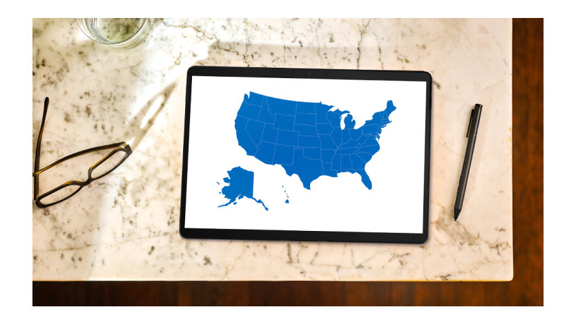 A laptop displaying a map of the United States.
