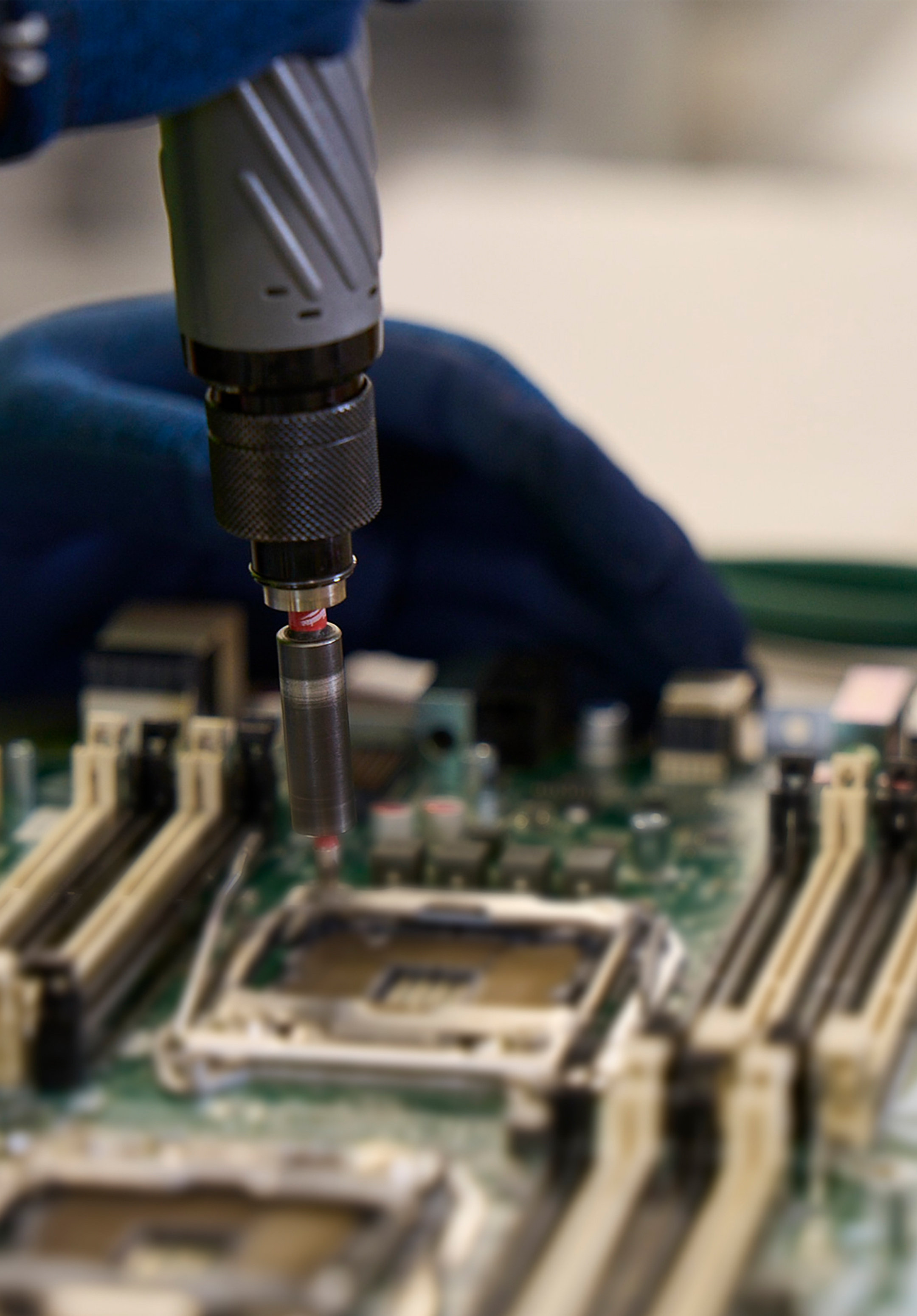 Close up of Datacenter Service Technician processing decommissioned servers in the Circular Center.