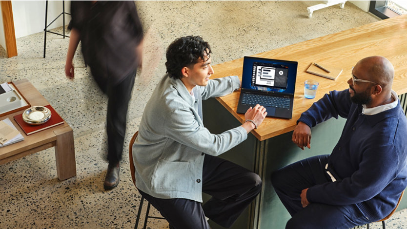 A device being used by a team in an office space using Windows 365.